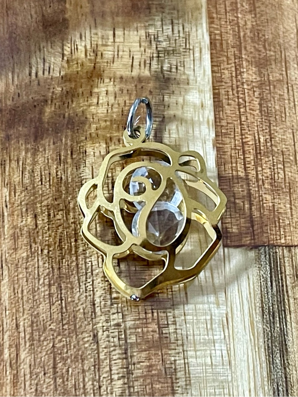 Gold-Tone floral shape and stone Pendant. New without tag